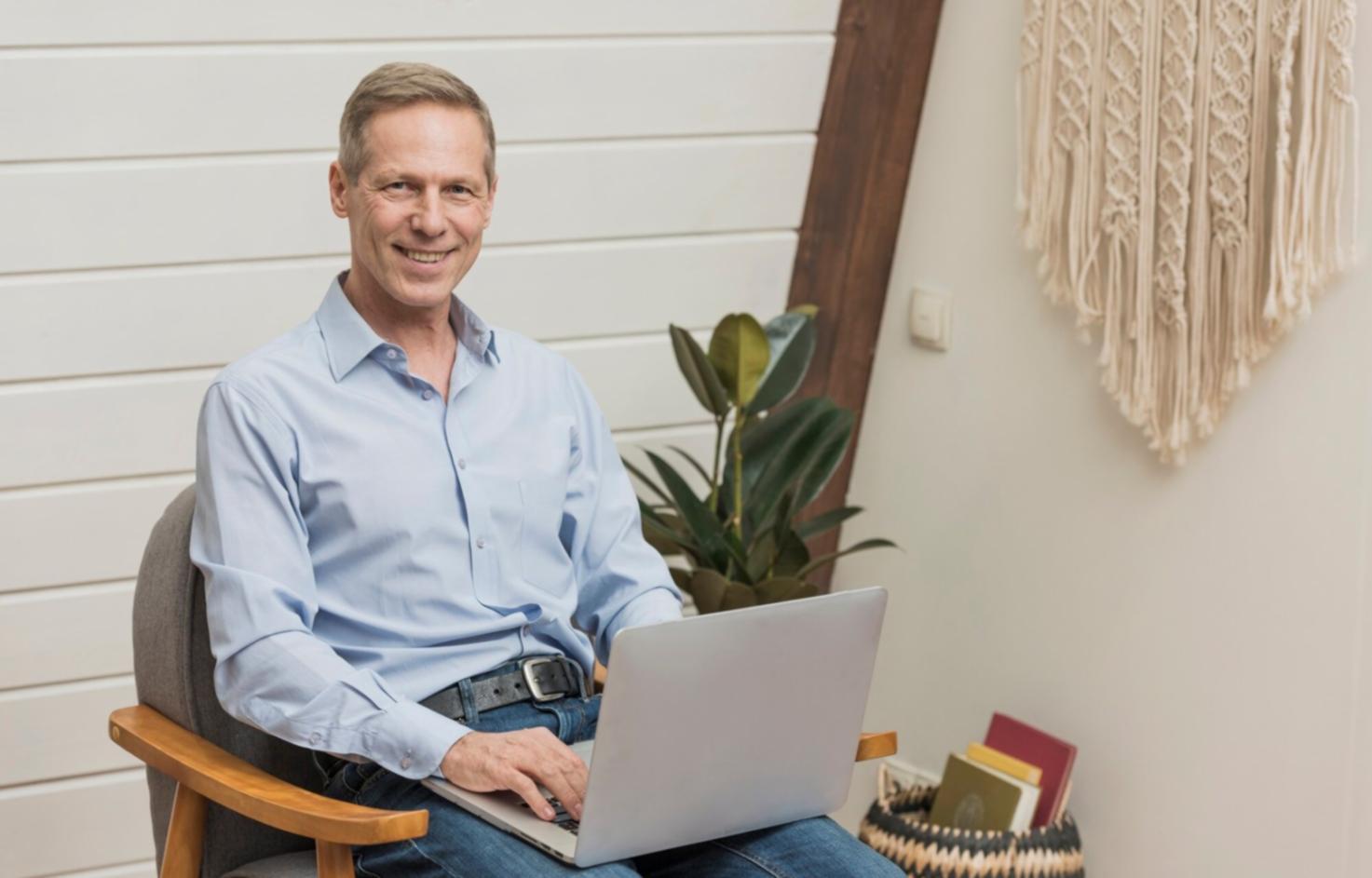 Professional working on financial analysis with multiple documents and computer screens